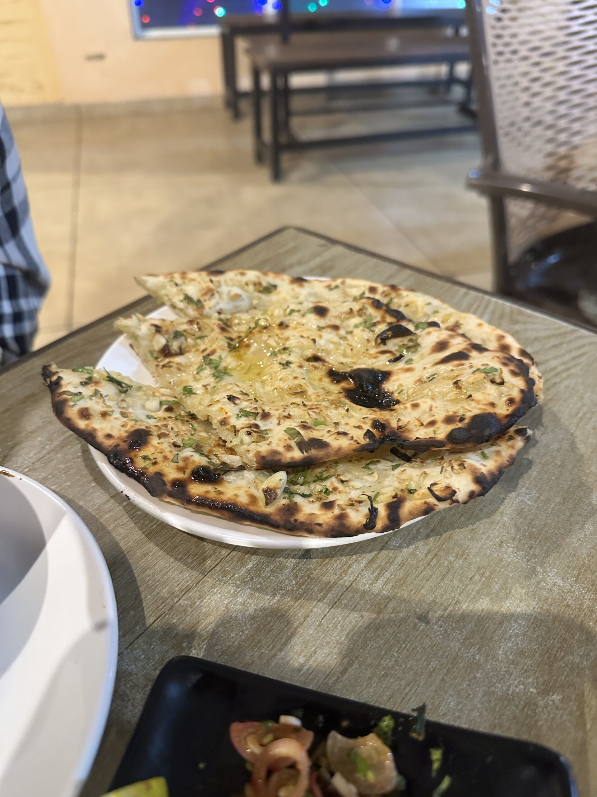 Butter Garlic Naan at Paradise by Meher Cafe