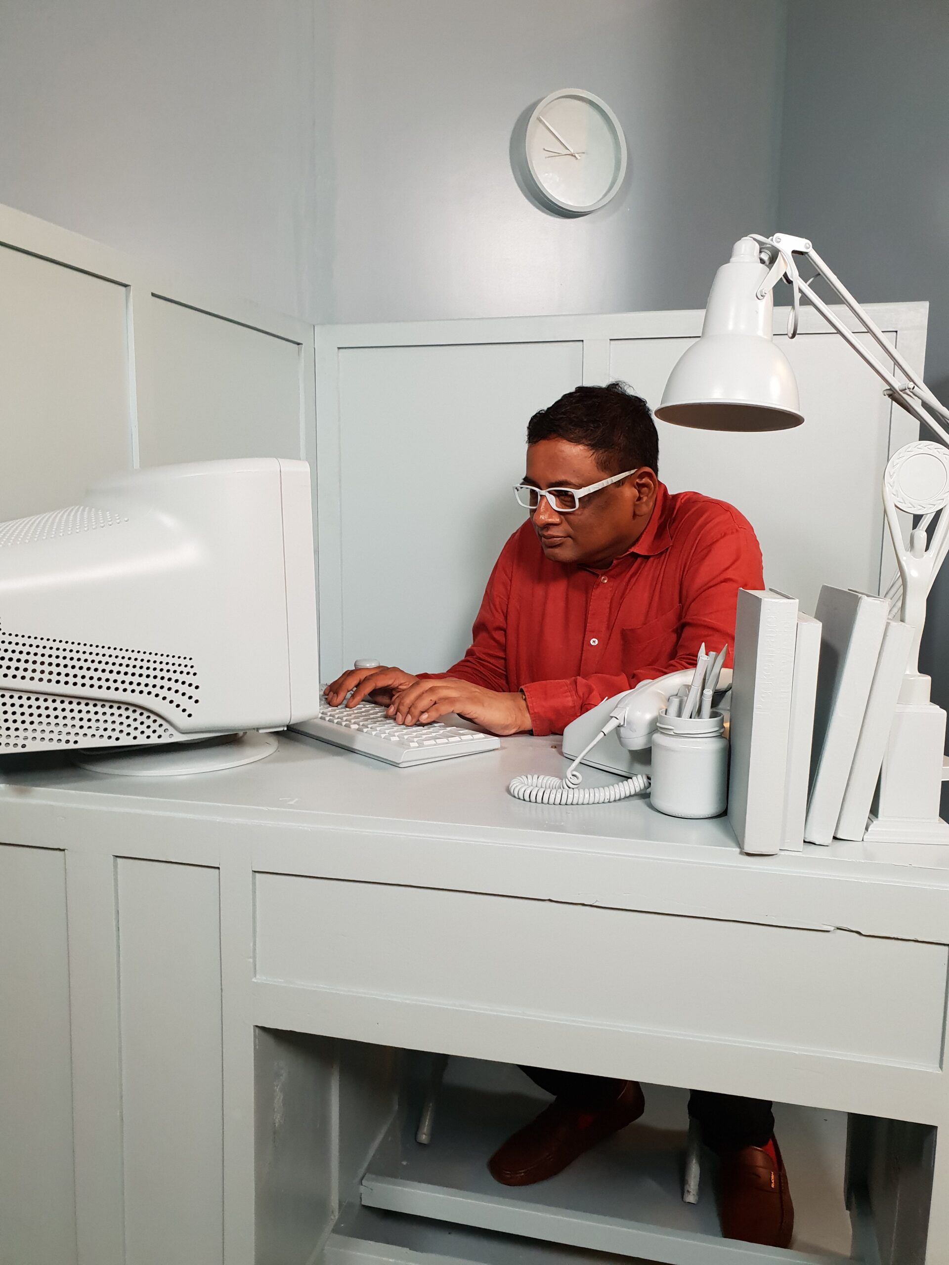 Sampath Iyengar in red shirt at all-white coworking workspace Mumbai