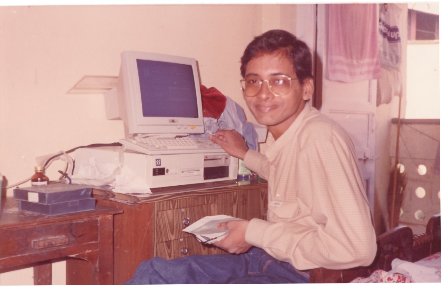 Young Sampath Iyengar with his first computer in Mumbai in the early 1990s the beginning of SAM7