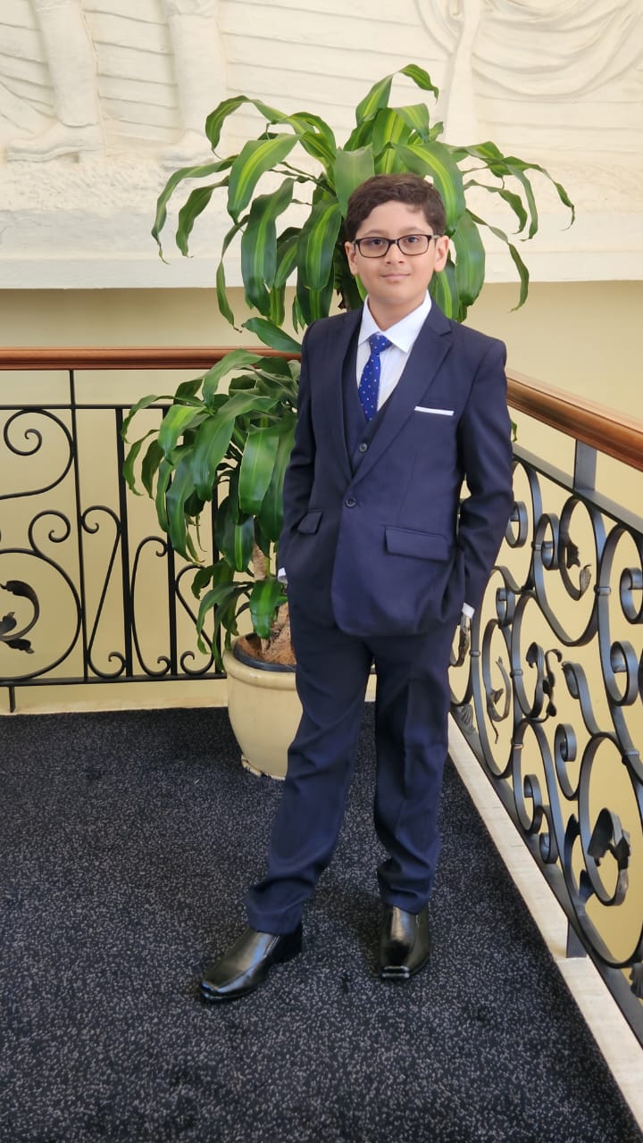 Vihaan Iyengar son of Carlon Iyengar dressed in navy suit Sydney Australia